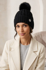 Black Knitted Pom Pom Beanie Cap With Snowflake Detail - Moon