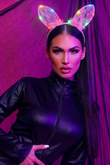 Model wearing a pink filigree cat ears headband with colourful LED lights, styled with a sleek black outfit for a Halloween look by Femme Luxe